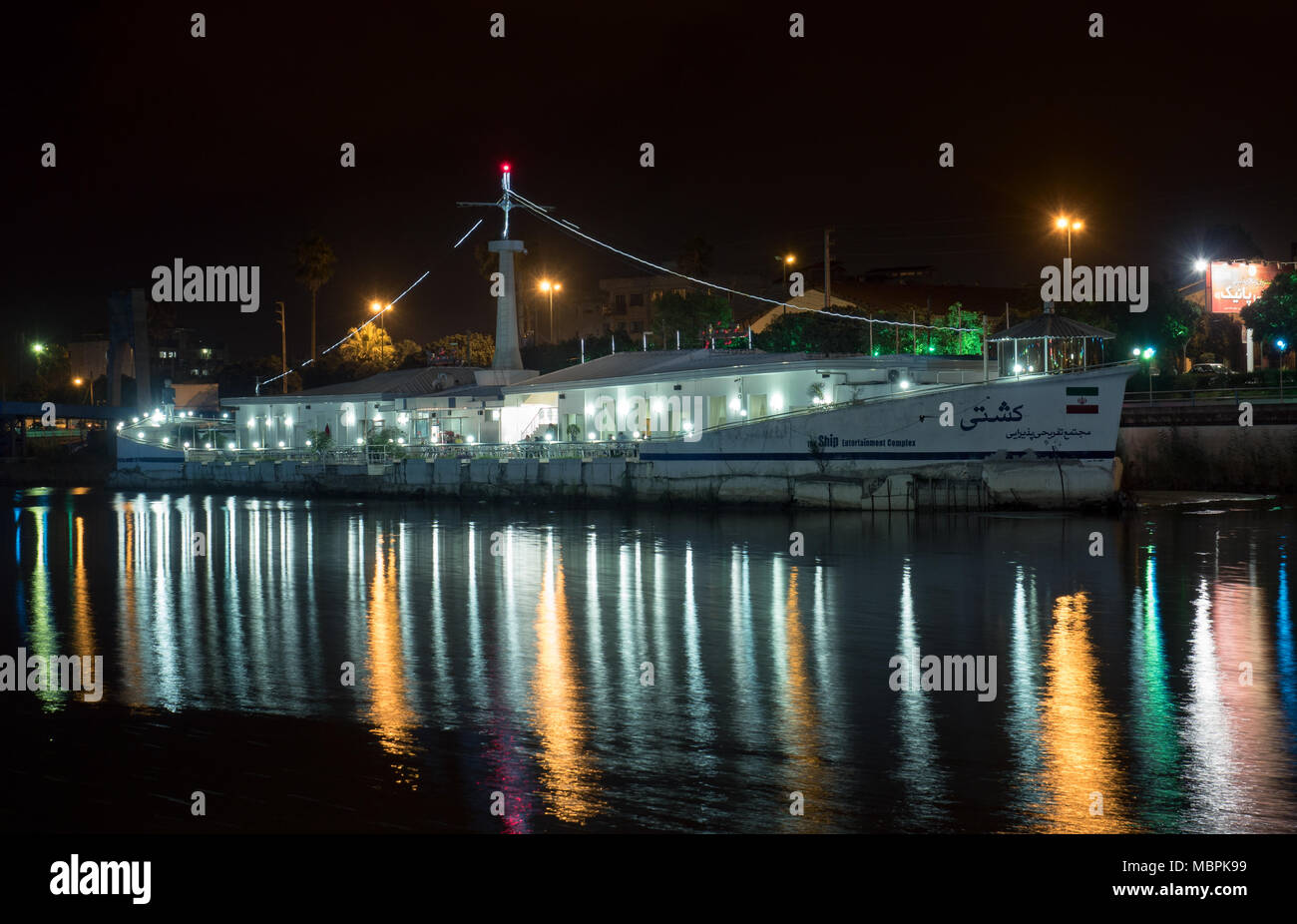 Floating restaurant ship by night, Babolsar, Iran Stock Photo