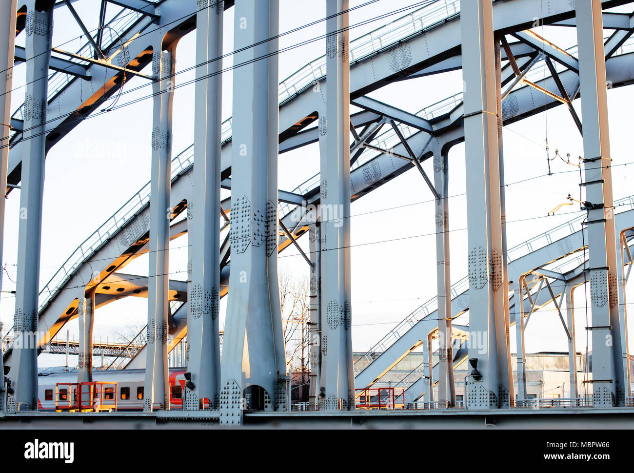 landscape with railway with trains, lot of steel rafters at suns Stock ...