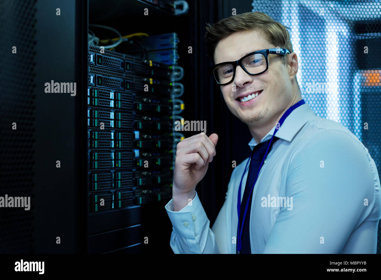 Smiling operator working in the data centre Stock Photo
