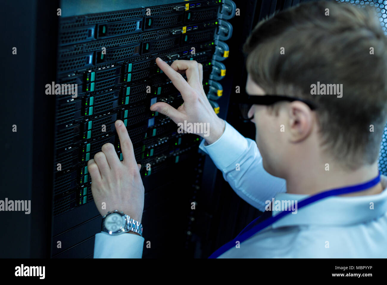 Man pressing digital buttons hi-res stock photography and images - Alamy