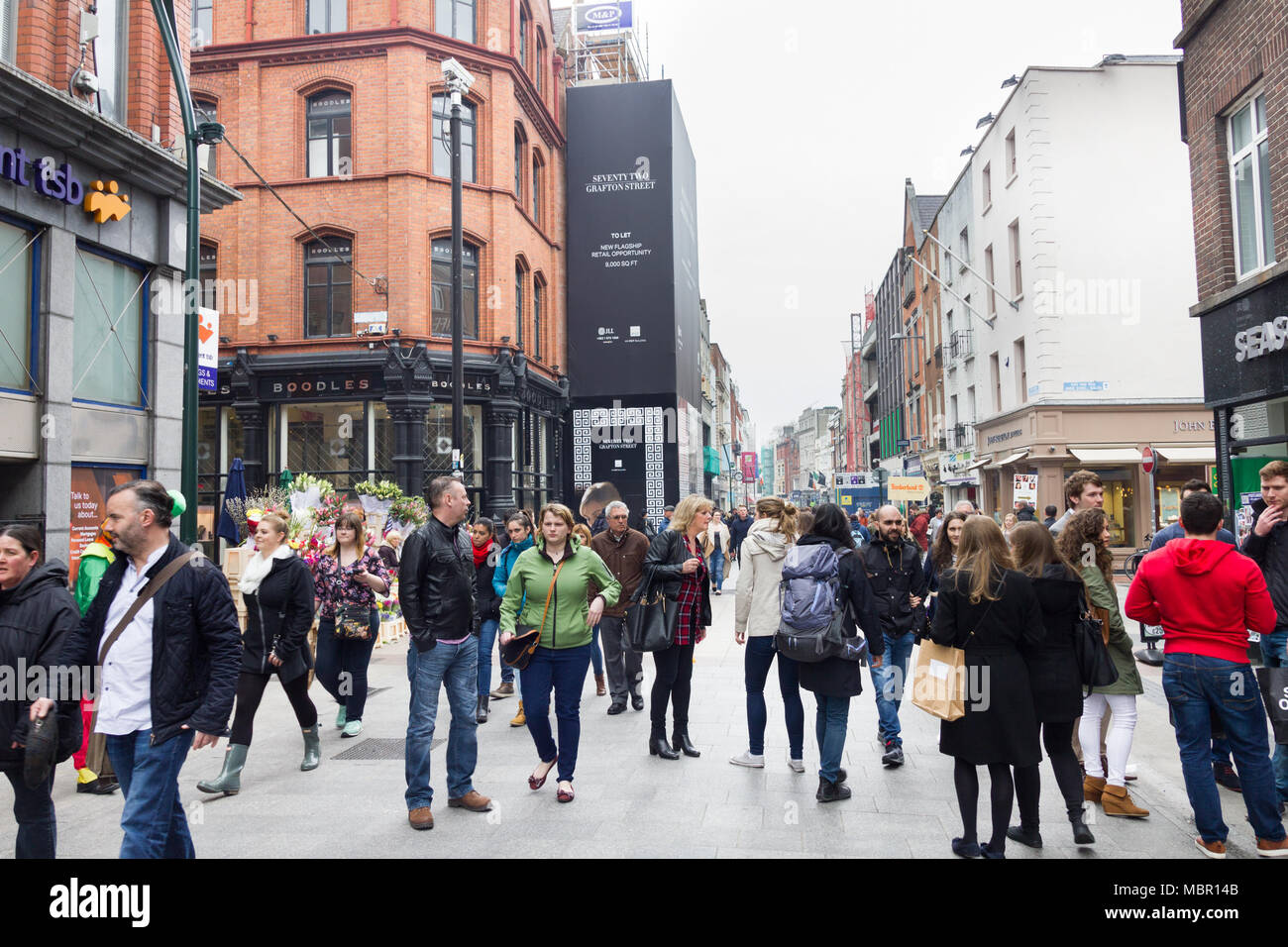 DUBLIN, IRELAND - 07 MAY, 2016: People walking on the Grafton Street. The main shopping street in the city is one of the most expensive in the world. Stock Photo