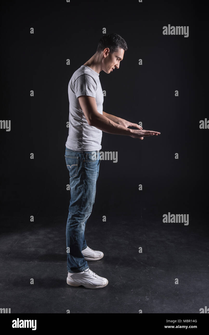 Nice smart man looking at the computer panel Stock Photo - Alamy