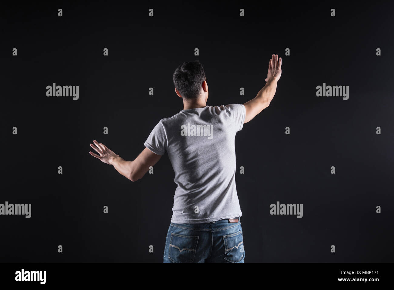 Nice smart man standing in front of the computer panel Stock Photo - Alamy