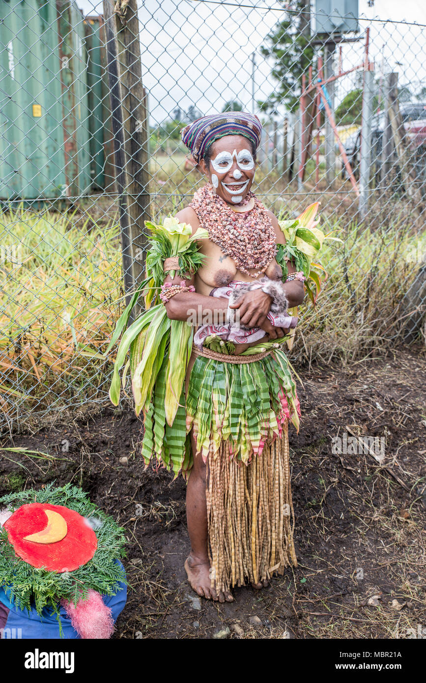Half-naked woman with face painting and traditional costume at Mount Hagen Cultural Show, Papua