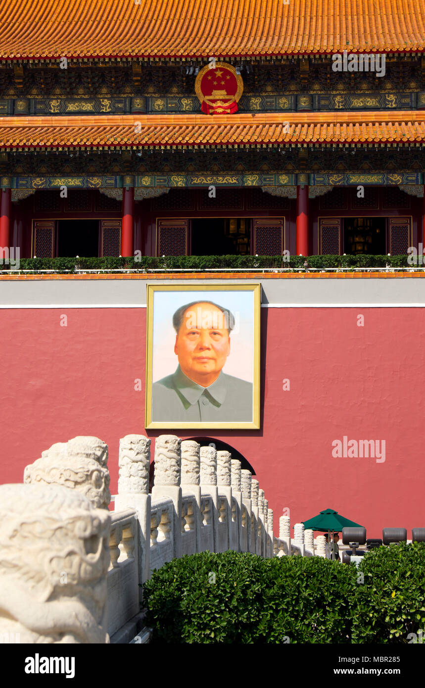 The entrance to the Forbidden City in Beijing, China, viewed across an ornamental bridge. Chairman Mao’s famous portrait hangs above the entrance gate Stock Photo