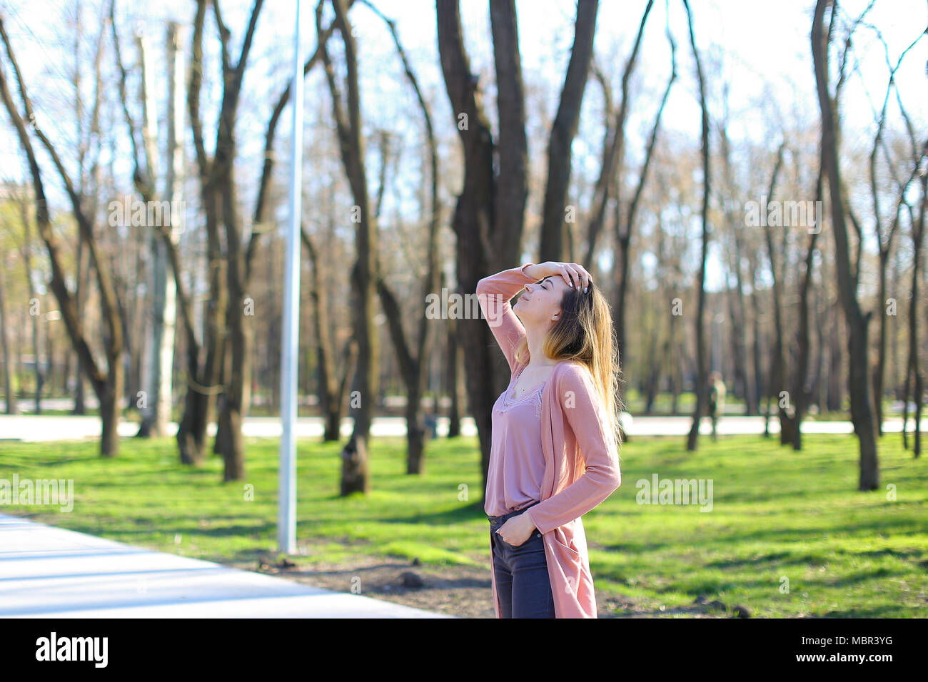 Young woman resting in park and breathing fresh air Stock Photo - Alamy
