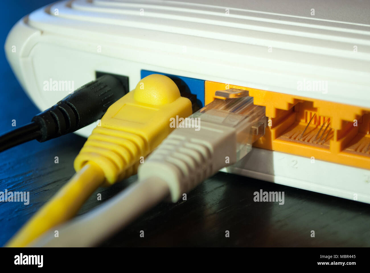 Internet UTP cable plugs in Wifi router. Close up. Internet concept.  Selective focus Stock Photo - Alamy
