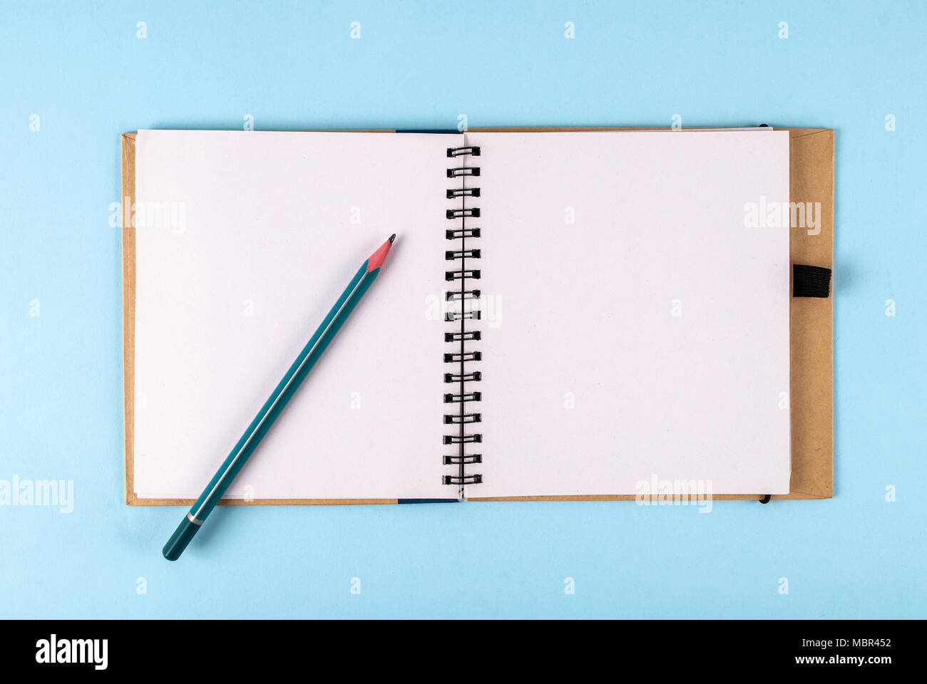 Open notebook and pencil with space for text Stock Photo