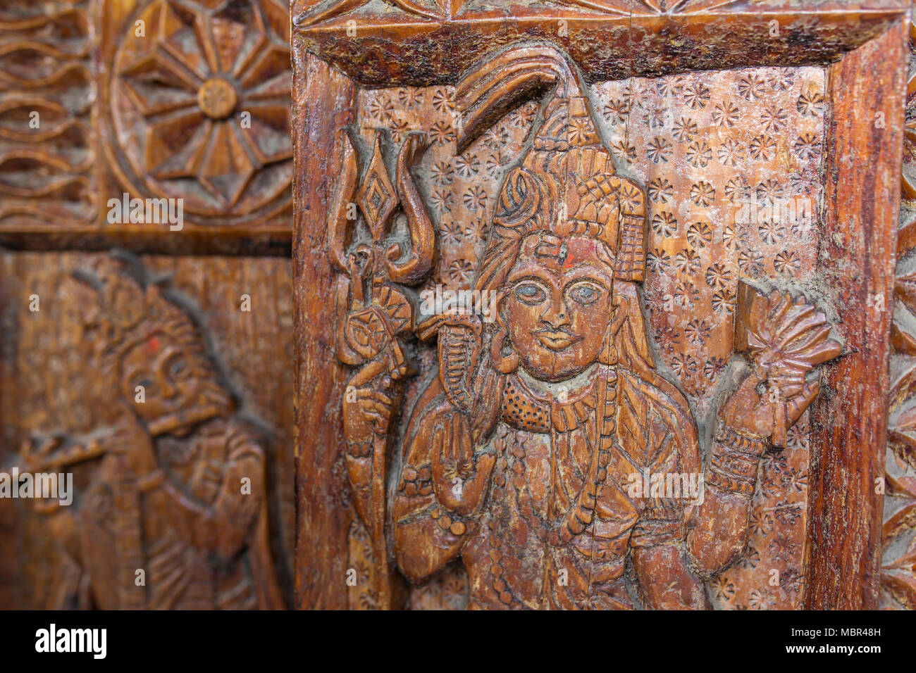 Traditional wooden carving on the hindu temple in Vashisht village in Kullu valley, Himachal Pradesh, India Stock Photo