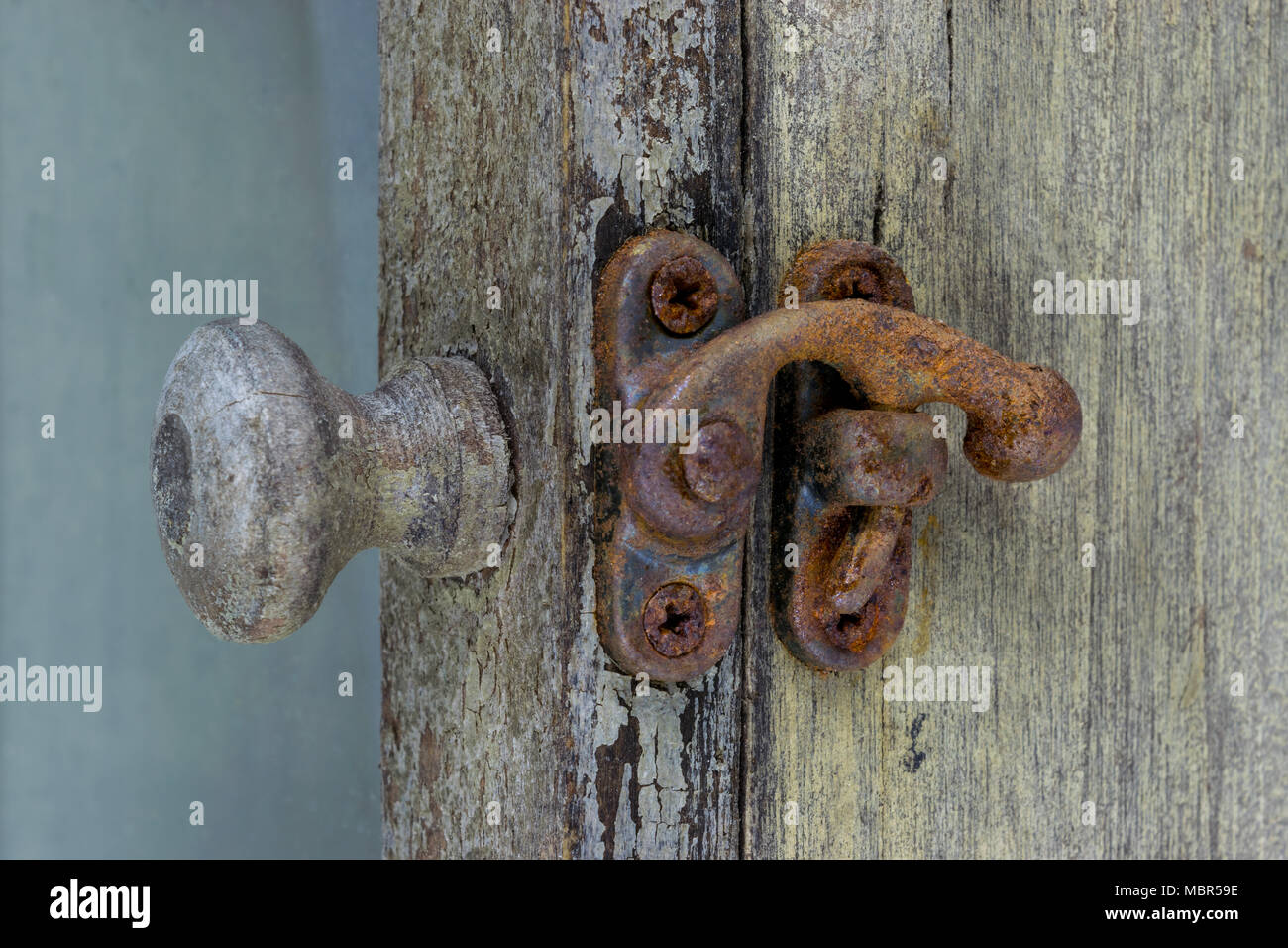Very old shelf with rusty lock and handle. Little bit visible remains ...
