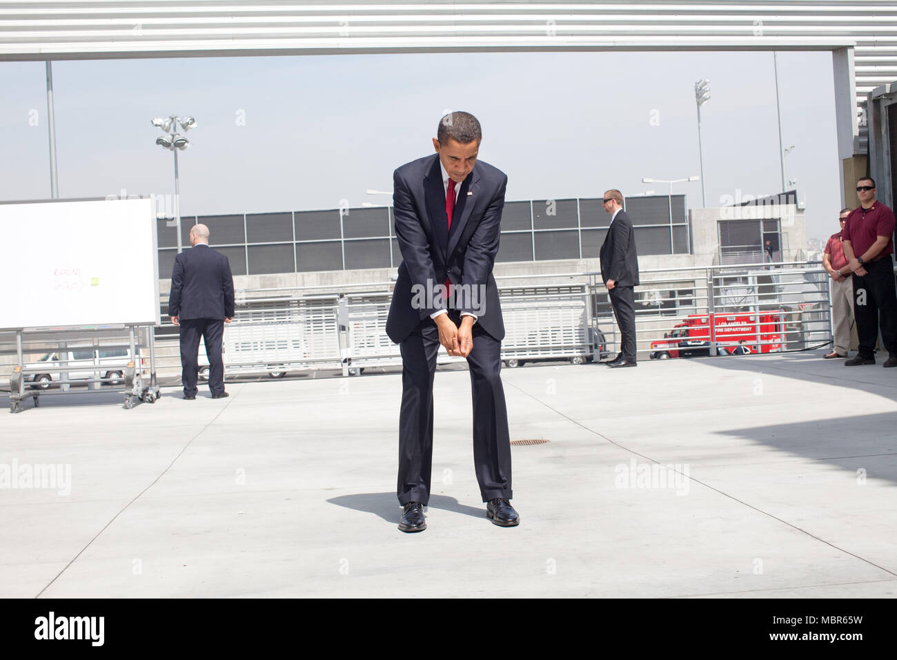 President Barack Obama practices his golf swing at an outdoor hold prior to an event at the Miguel Contreras Learning Center, Los Angeles, California 3/19/09.. Official White House Photo by Pete Souza. Stock Photo
