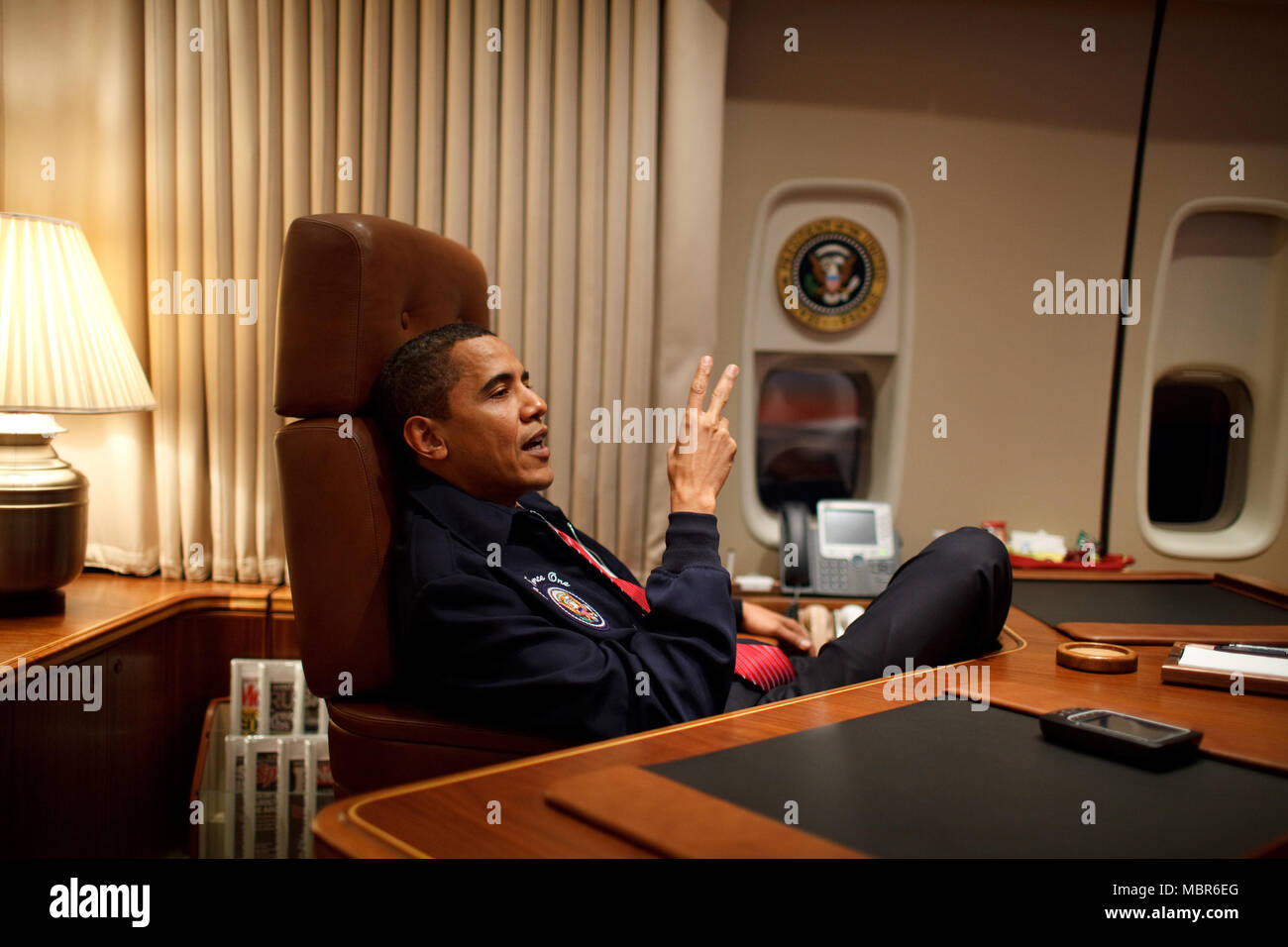 President Barack Obama wears an Air Force One jacket on his first