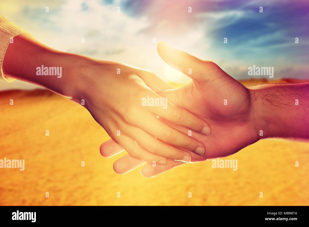 Touching hands - warm mood Stock Photo