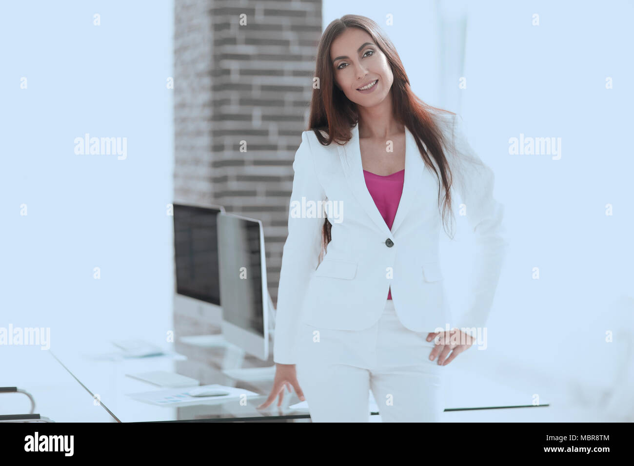 elegant business woman in a white business suit Stock Photo - Alamy