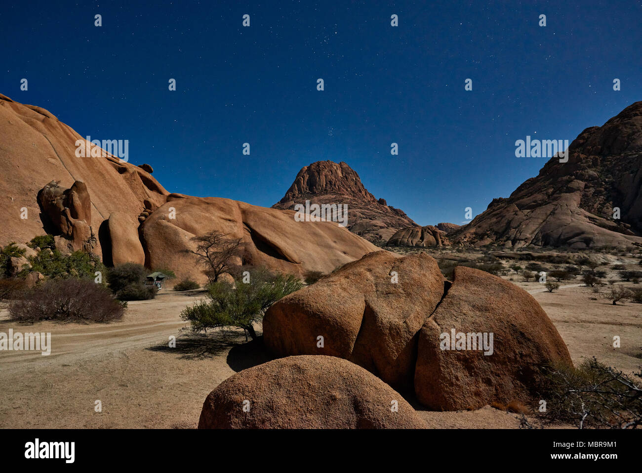 night shot under moonlight with stars of Spitzkoppe Stock Photo
