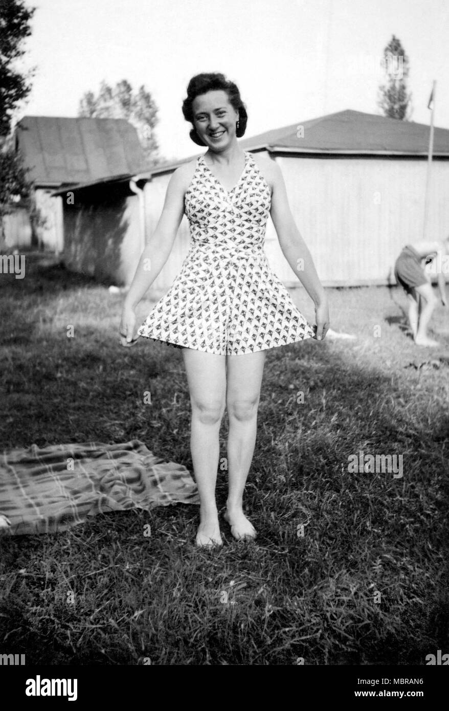 Fashion, Woman proudly shows her summer dress, 1940s, Germany Stock Photo