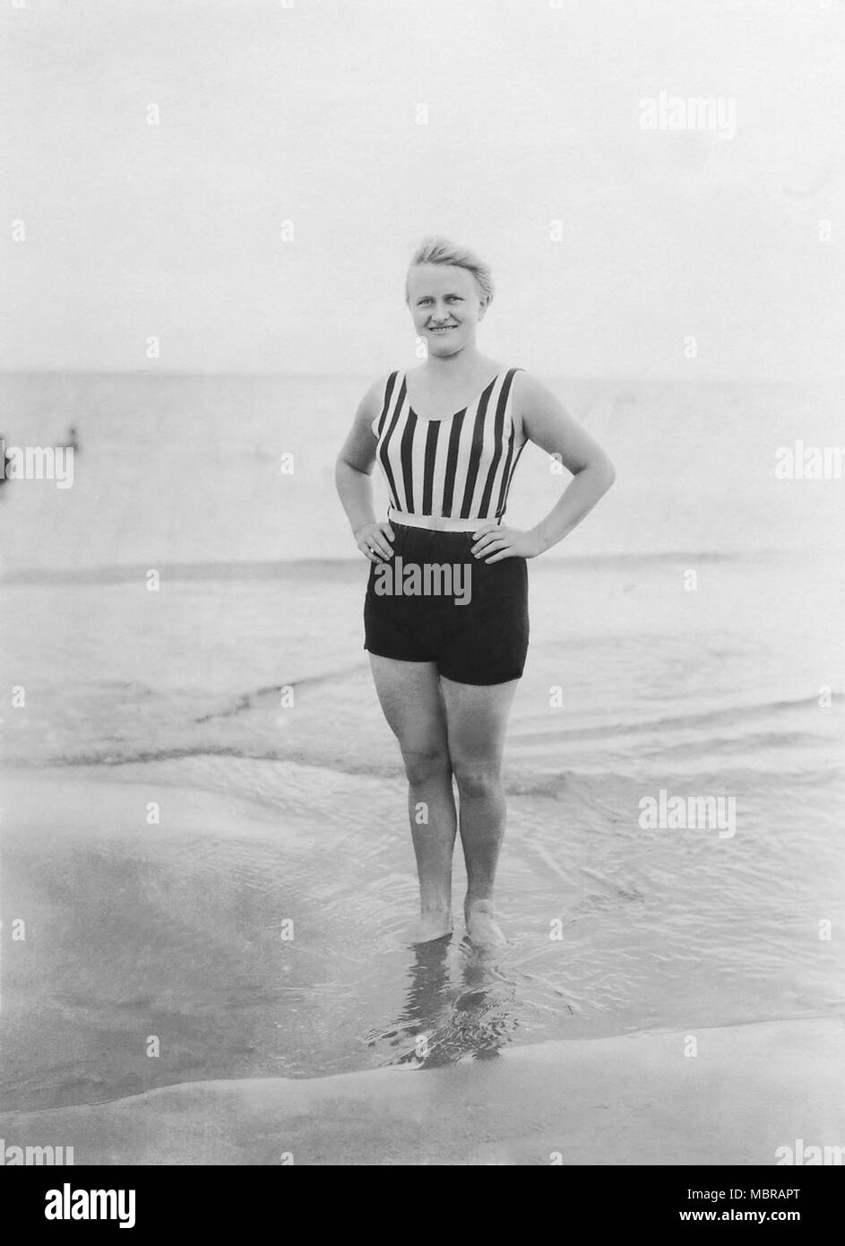 Fashion, swimwear, woman in fashionable swimsuit on the beach, 1940s