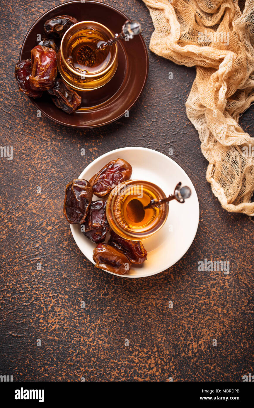 Traditional arabic tea and dry dates Stock Photo Alamy