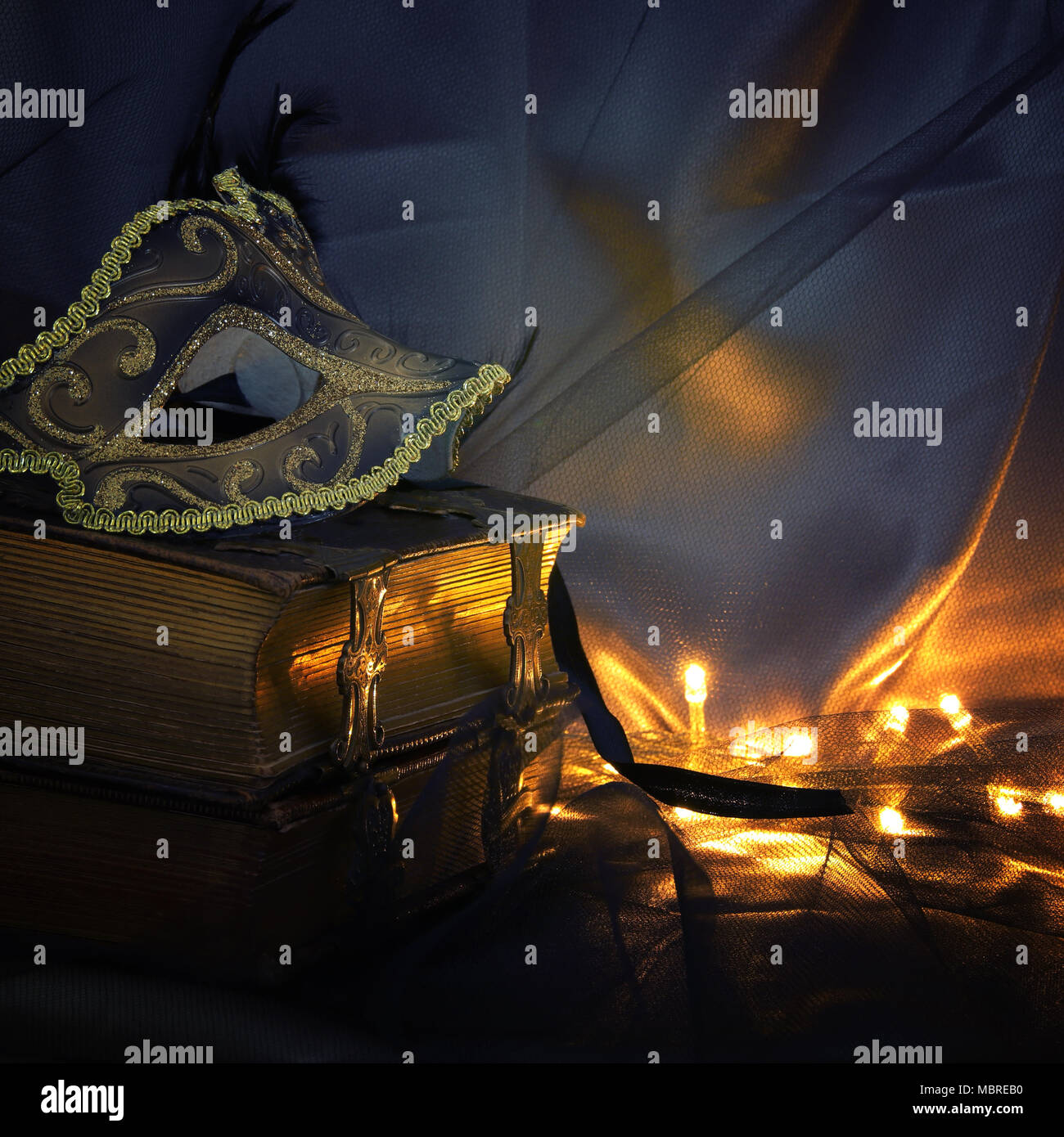 Image of elegant gold and black venetian mask over tulle background ...