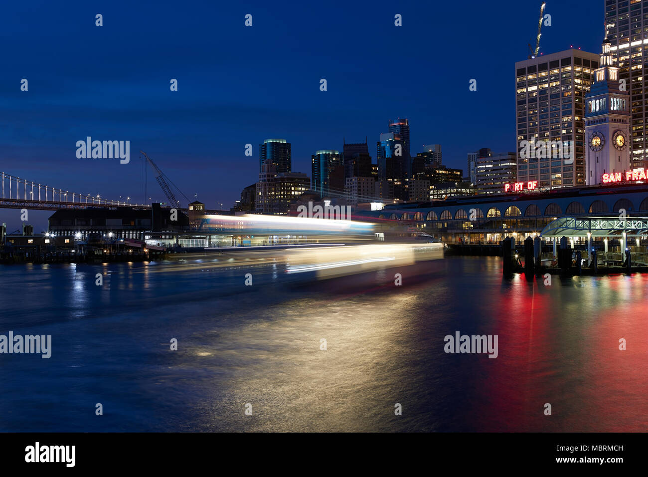 Motion Blur (Light Trail) Of An Arriving Ferry At The San Francisco Ferry Building Before Sunrise. Stock Photo
