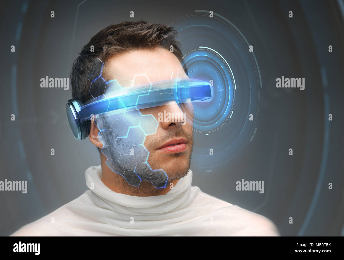 man in 3d glasses with virtual hologram Stock Photo