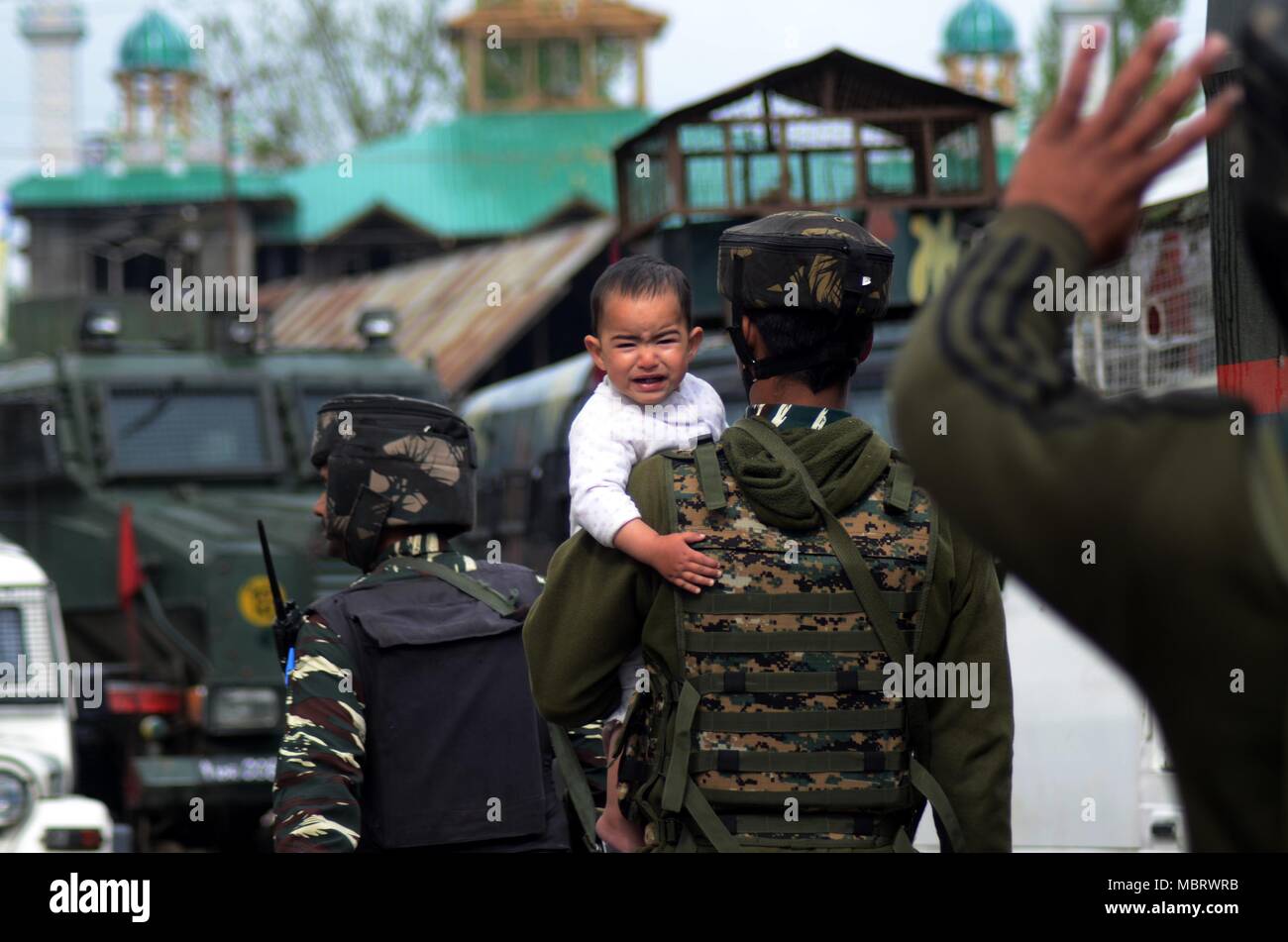 PORTRAIT OF INDIAN SOLDIER DRESSED IN UNIFORM HOLDING A HAND GUN Stock  Photo - Alamy