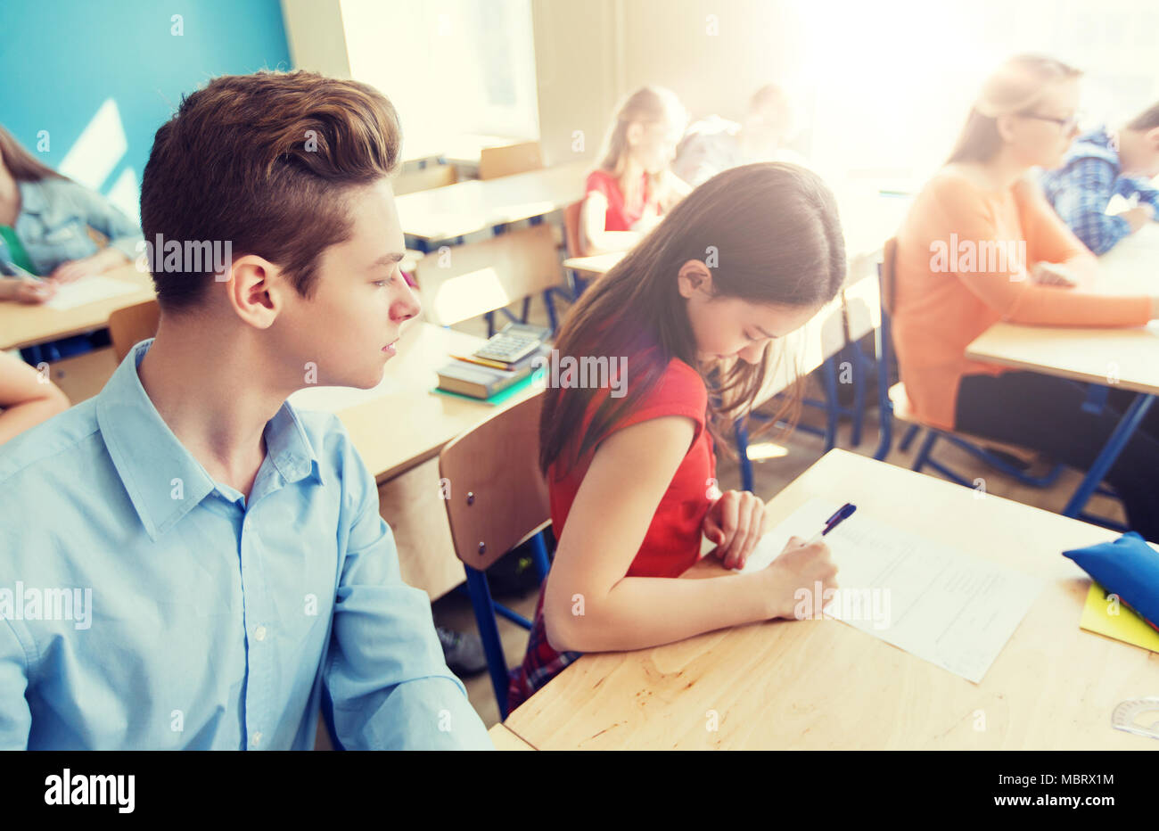 group of students writing school test Stock Photo