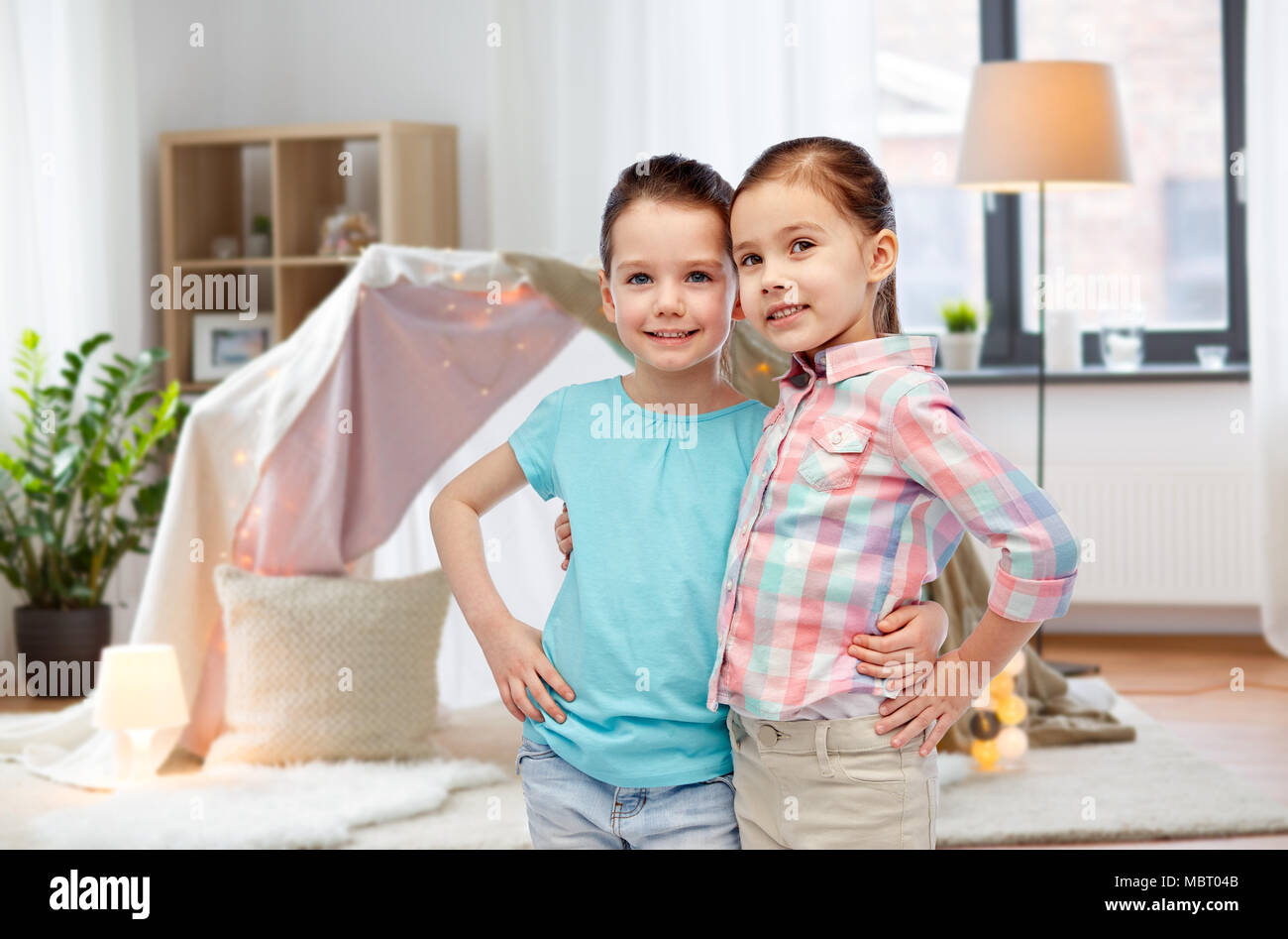 happy smiling little girls hugging at home Stock Photo - Alamy