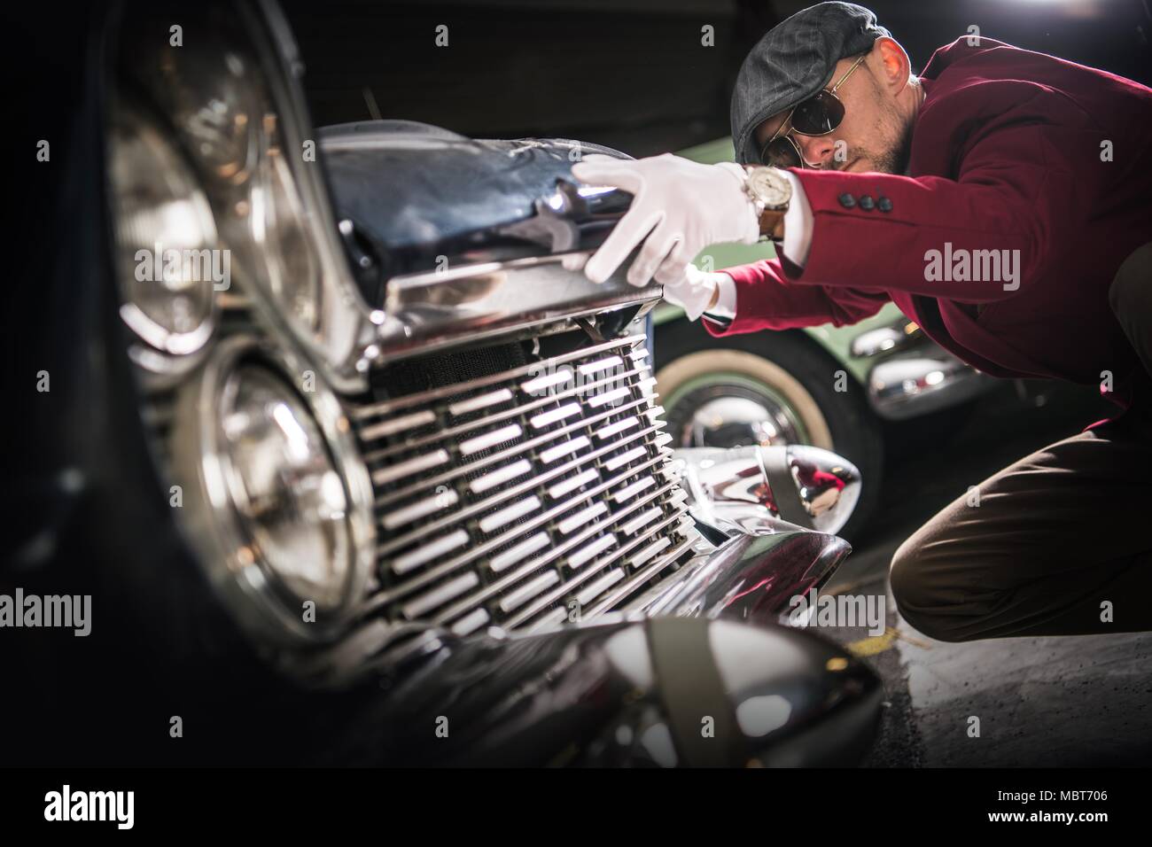 Classic Car Collector Evaluation. Caucasian Men Taking Close Look on the Vintage American Vehicle For Sale. Stock Photo
