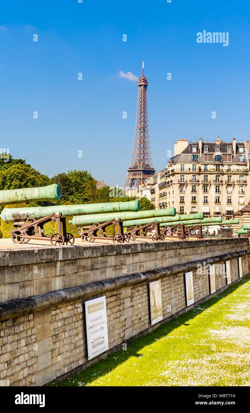 Historic Napoleonic artillery gun near National Residence of Invalids with the Eiffel tower in the background Stock Photo