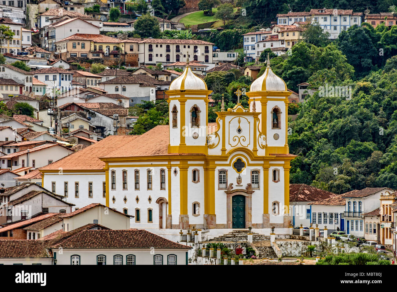 Old church between the houses and streets of the city of Ouro preto in Minas Gerais Stock Photo