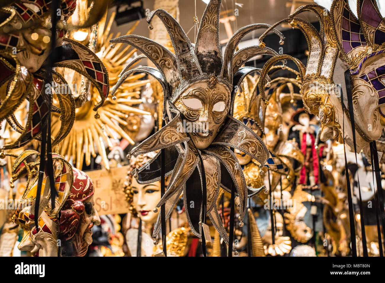 Gold masquerade masks in Venice Italy shop Stock Photo