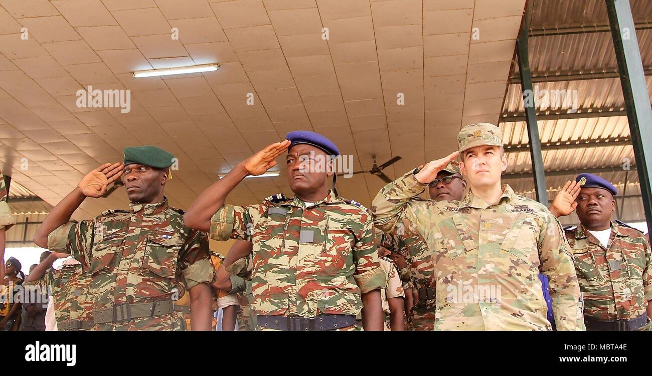 Maj. Andrzej Kujawski, Task Force Darby commander at CL Garoua, is invited by Col. Tsilla, the Cameroonian Air Force commander of base 301, to participate in a bi-annual promotion ceremony Jan. 1 Garoua, Cameroon. TF Darby soldiers are serving in a support role for the Cameroon military’s fight against the violent extremist organization Boko Haram. Stock Photo