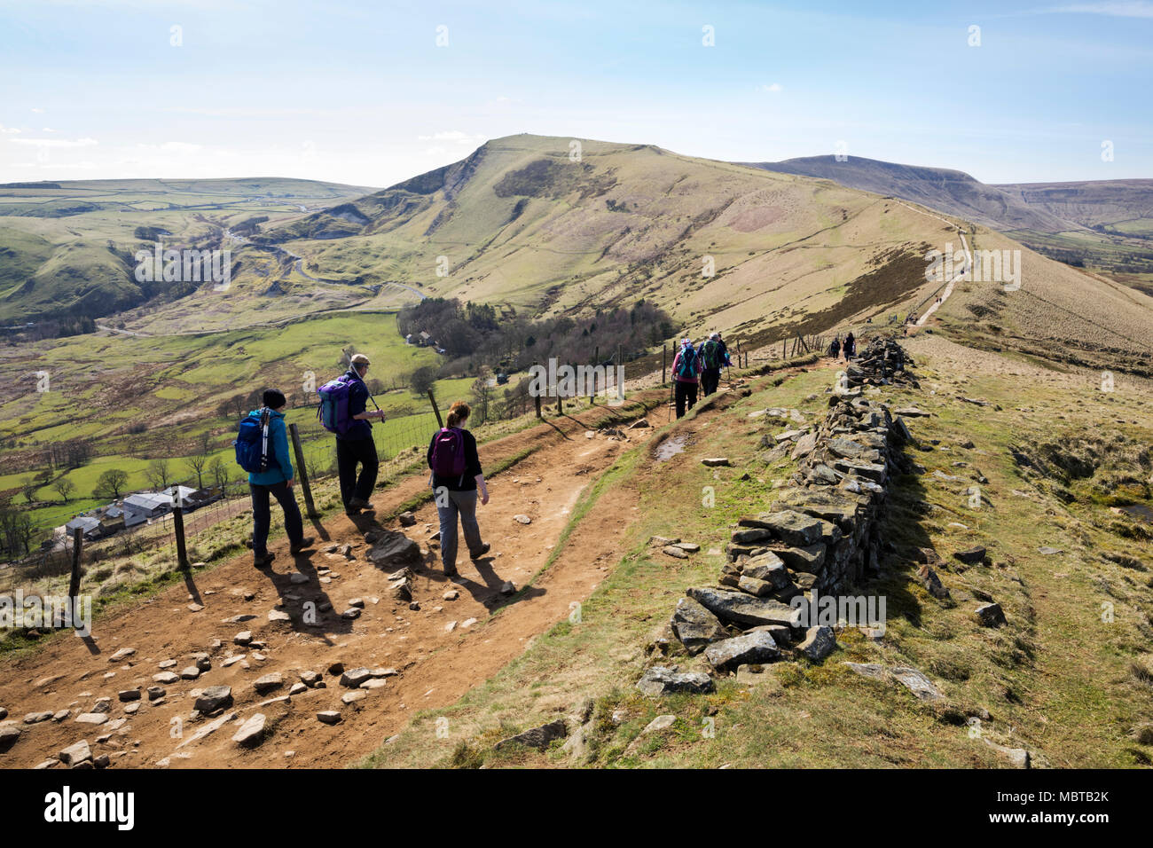 Walkers on the Great Ridge walk at Hollins Cross with view of Mam Tor and Hope and Edale valleys, Castleton, Peak District National Park Stock Photo