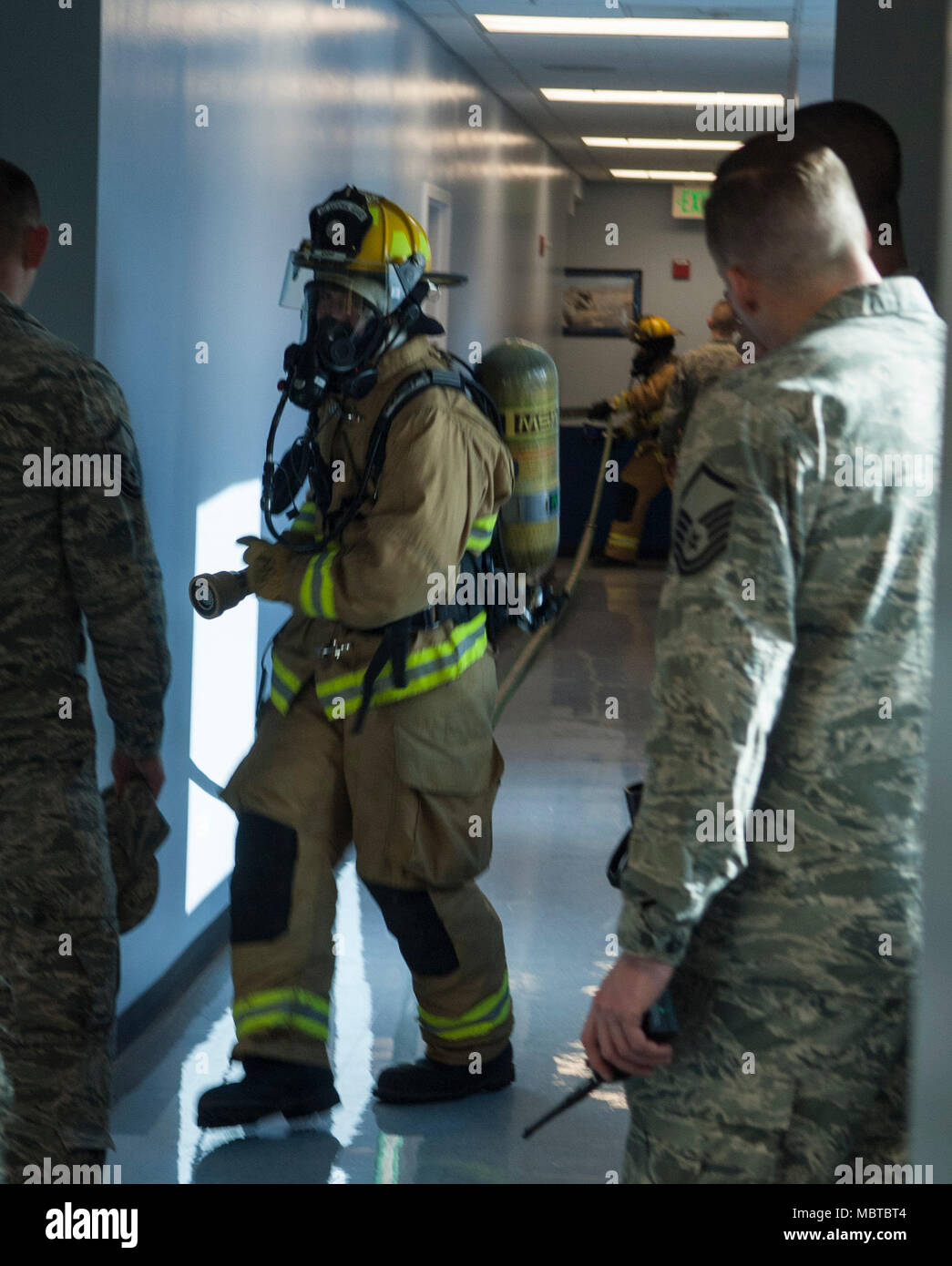 Master Sgt. Jason Legget, a firefighter supervisor assigned to the 152nd Civil Engineer Squadron is overseeing firefighters in a structure at the Nevada Air National Guard base January 7, 2018. Leggett said “Exercises like this get the firefighters out of their comfort zone.” Stock Photo