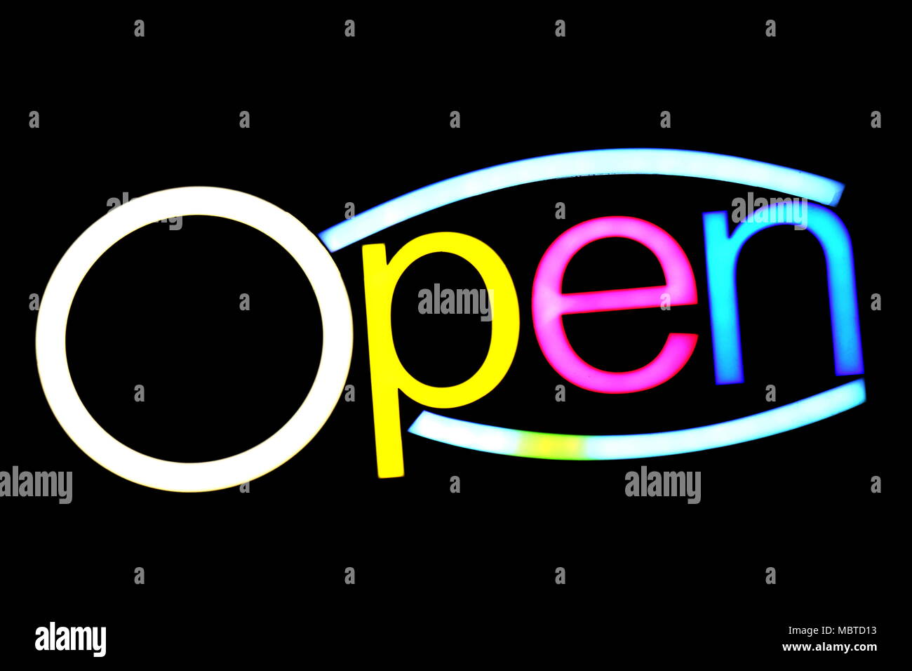 blurred text OPEN sign LED Bokeh light colorful on dark wall, Neon Light led letter Open on background black Stock Photo