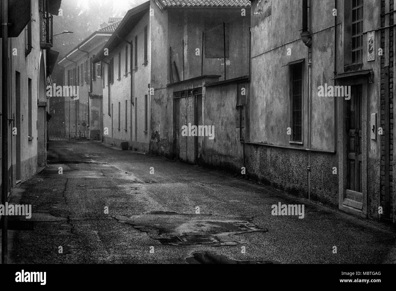 The mistic street in the city, foggy day in Italy Stock Photo