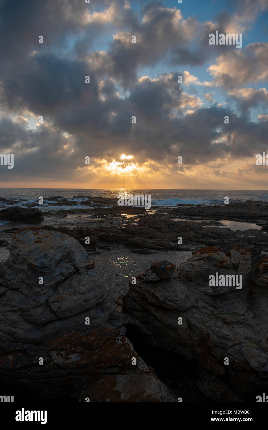 A beautiful sunset viewed from the rocks at Cape St Francis Stock Photo