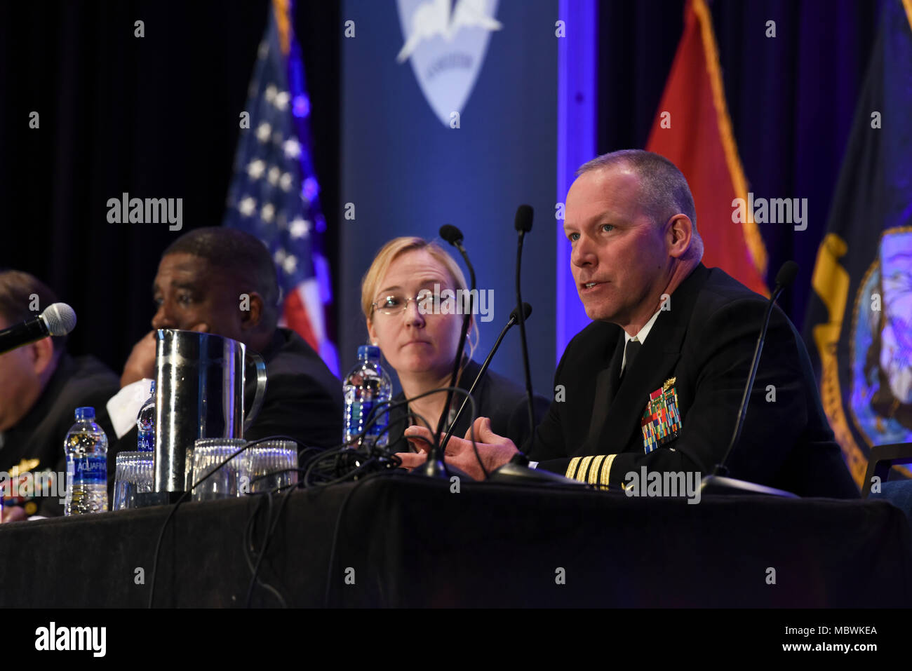 180110-N-EX237-045  CRYSTAL CITY, Va. (Jan. 10, 2018)   Capt. Steve Murray addresses attendees during the Surface Warfare Domains-Integrating to Win panel at the Surface Navy Association’s 30th National Symposium. This year's symposium focuses on 'Surface Forces and Cross-Domain Integration,' highlighting common procedures and combined exercises across air, land, maritime, space and cyberspace domains in preparation for a more powerful and integrated Naval Surface Force. (U.S. Navy photo by Mass Communication Specialist 2nd Class Lauren K. Jennings/Released) Stock Photo
