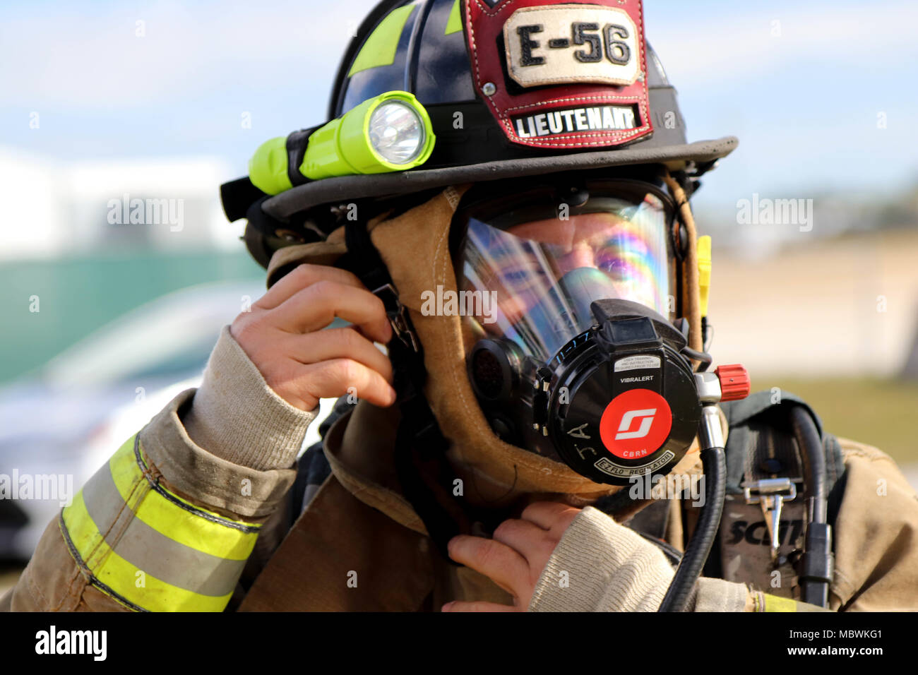 lieutenant-jose-alfaro-of-the-miami-dade-fire-department-hazmat-team-dons-his-self-contained-breathing-apparatus-during-a-joint-training-exercise-hosted-by-the-miami-dade-fire-department-and-homestead-miami-speedway-in-miami