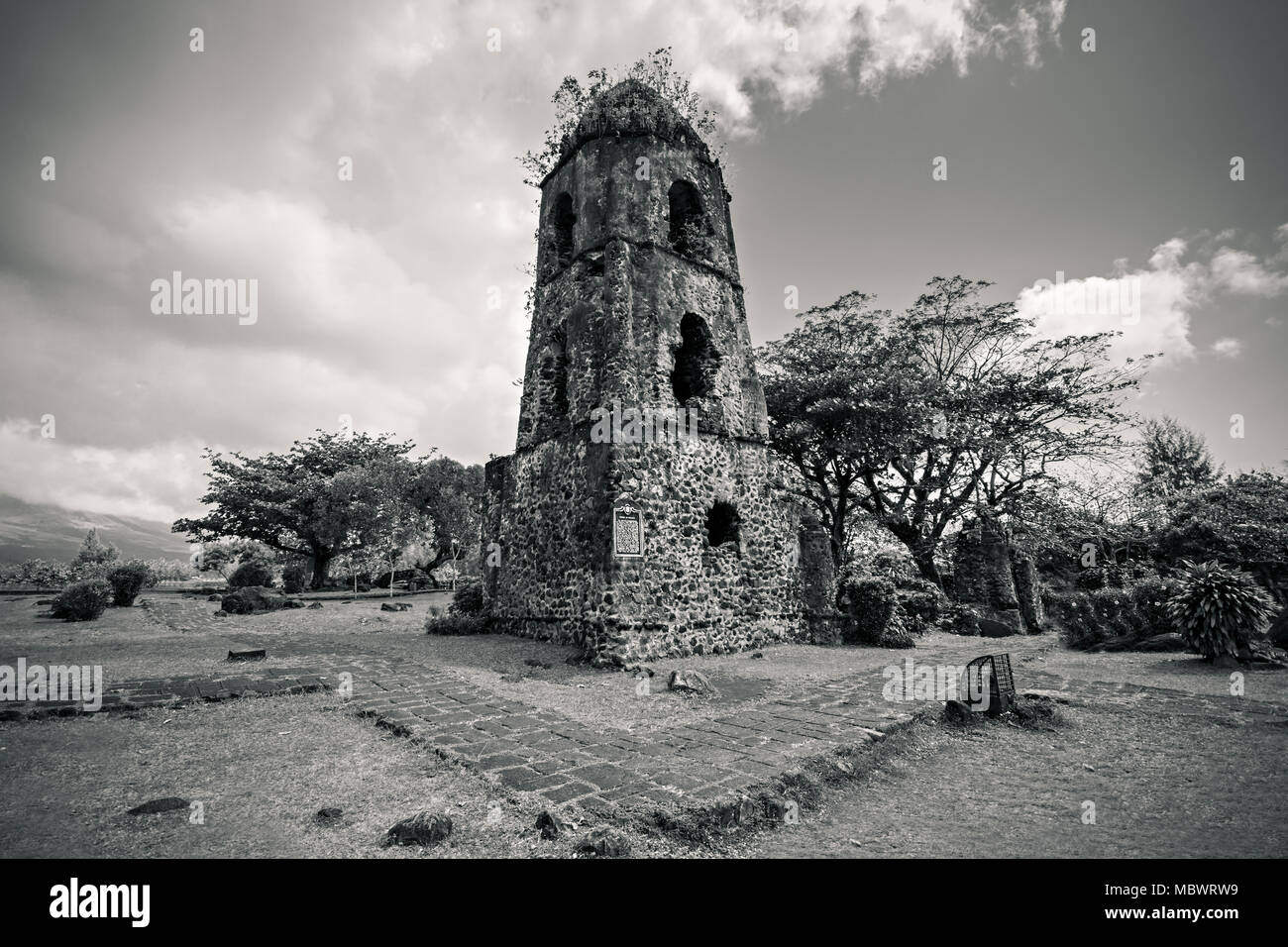 Cagsawa Ruins are the remnants of an 18th century Franciscan church, built in 1724 and destroyed by the 1814 eruption of the Mayon Volcano. Stock Photo