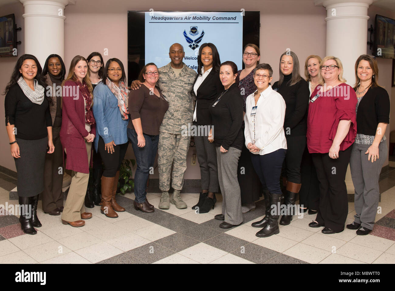 Chief Master Sgt. of the Air Force Kaleth O. Wright and his wife, Tonya Wright, pose for a group photo with the spouses of the Air Mobility Command Chief Leadership Course attendees, Jan. 11, 2018, at Scott Air Force Base, Illinois. Wright visited Scott AFB to talk with course attendees and offer leadership advice. (U.S. Air Force photo by Airman 1st Class Tara Stetler) Stock Photo