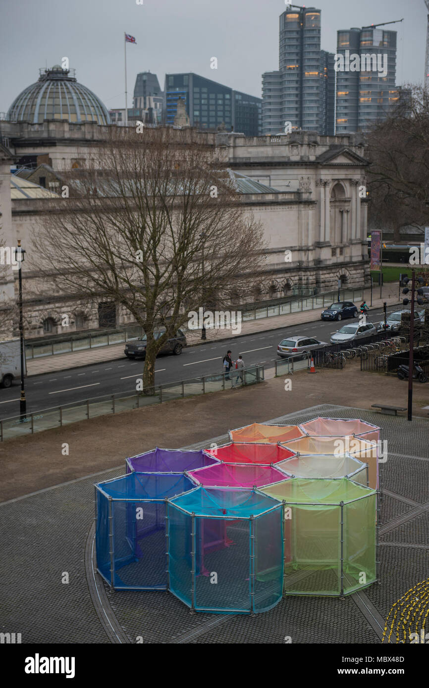 London, UK. 11th April 2018. The Inevitable by multi media Artist Sally Buchanan as part of this year’s The Flux Exhibition, on the Rootstein Hopkins Parade Ground of Chelsea College of The Arts. An outdoor interactive installation, consisting of over 220 metres of Organza and 25 yards of Crinoline fabric allowing visitors to walk through a simple series of 10 interlinked hexagonal compartments. It will be there from 11th – 15th April 2018. Credit: Guy Bell/Alamy Live News Stock Photo