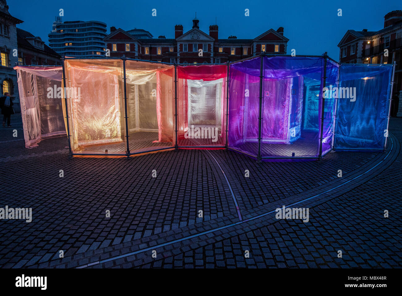 London, UK. 11th April 2018. The Inevitable by multi media Artist Sally Buchanan as part of this year’s The Flux Exhibition, on the Rootstein Hopkins Parade Ground of Chelsea College of The Arts. An outdoor interactive installation, consisting of over 220 metres of Organza and 25 yards of Crinoline fabric allowing visitors to walk through a simple series of 10 interlinked hexagonal compartments. It will be there from 11th – 15th April 2018. Credit: Guy Bell/Alamy Live News Stock Photo