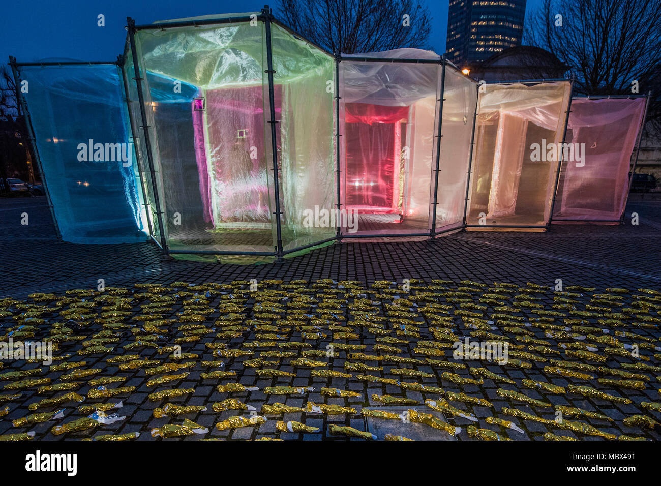 London, UK. 11th April 2018. The Inevitable by multi media Artist Sally Buchanan as part of this year’s The Flux Exhibition, on the Rootstein Hopkins Parade Ground of Chelsea College of The Arts. An outdoor interactive installation, consisting of over 220 metres of Organza and 25 yards of Crinoline fabric allowing visitors to walk through a simple series of 10 interlinked hexagonal compartments. It will be there from 11th – 15th April 2018. Credit: Guy Bell/Alamy Live News Stock Photo