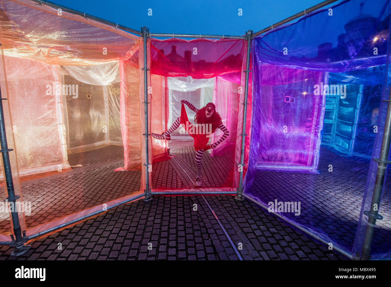 London, UK. 11th April 2018. The Inevitable by multi media Artist Sally Buchanan as part of this year’s The Flux Exhibition, on the Rootstein Hopkins Parade Ground of Chelsea College of The Arts. An outdoor interactive installation, consisting of over 220 metres of Organza and 25 yards of Crinoline fabric allowing visitors to walk through a simple series of 10 interlinked hexagonal compartments. It will be there from 11th – 15th April 2018. Credit: Guy Bell/Alamy Live News Stock Photo