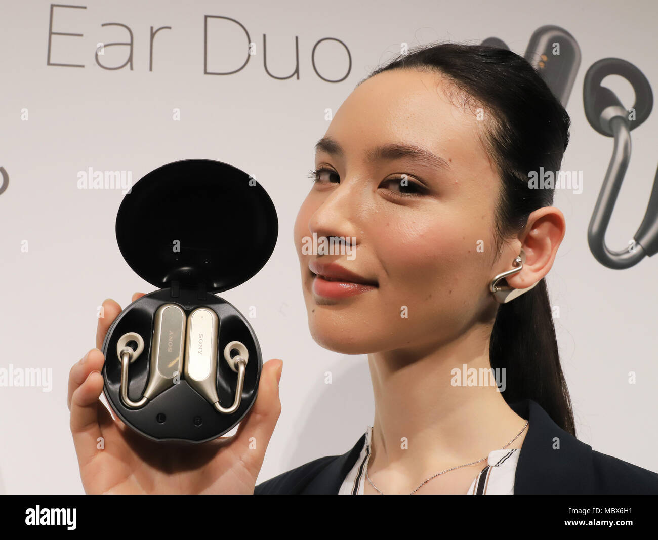 Tokyo, Japan. 11th Apr, 2018. A model displays Sony Mobile's new smart ear  phone \