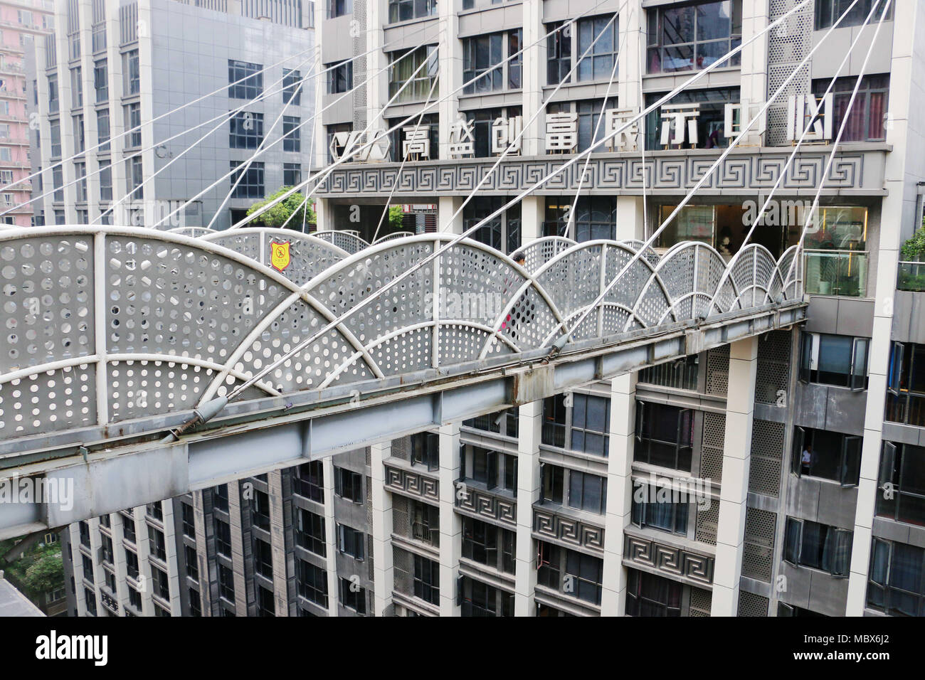 Chongqin, Chongqin, China. 12th Apr, 2018. Chongqing, CHINA-12th April 2018: A 68-meter-high overpass connecting two buildings can be seen in southwest China's Chongqing. Credit: SIPA Asia/ZUMA Wire/Alamy Live News Stock Photo