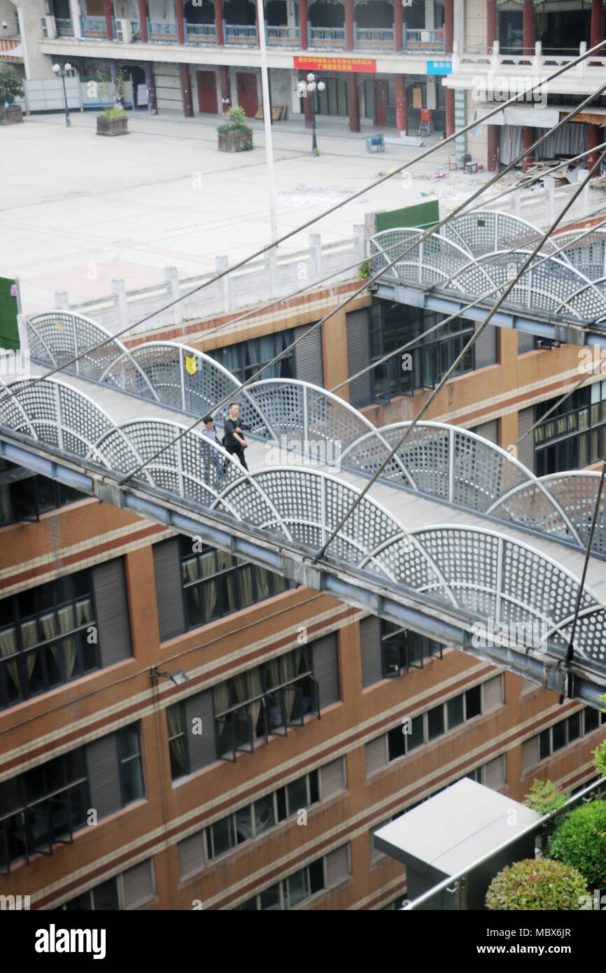 Chongqin, Chongqin, China. 12th Apr, 2018. Chongqing, CHINA-12th April 2018: A 68-meter-high overpass connecting two buildings can be seen in southwest China's Chongqing. Credit: SIPA Asia/ZUMA Wire/Alamy Live News Stock Photo