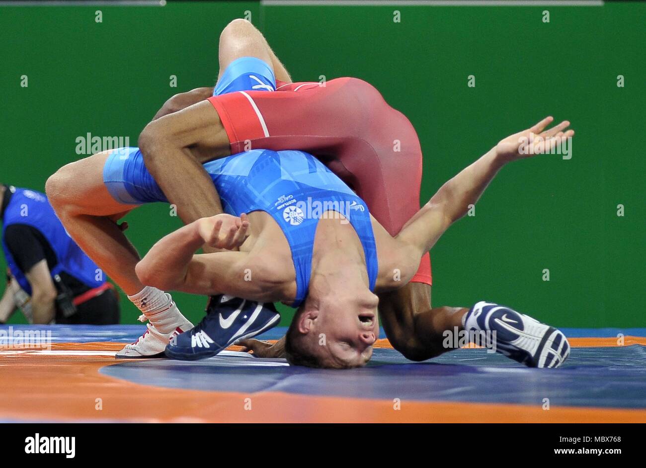 Queensland, Australia. 12th April, 2018. Ross Connelly (SCO, blue) and  Divoshan Charles Fernando (SRI, red). Mens 57kg. Wrestling. XXI  Commonwealth games. Carrara sports arena 1. Gold Coast 2018. Queensland.  Australia. 12/04/2018. Credit: